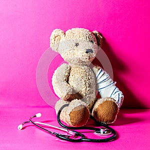 Checking child health and injury with teddy bear concept