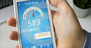 Checking credit score on smartphone using application. The result is AVERAGE