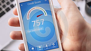 Checking credit score on smartphone using application. The result is EXCELLENT