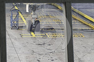 Checking the front wheels of the aircraft.