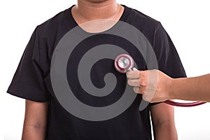 Checking heart and health care concept : Woman holding Stethoscope and check on red heart isolated on white