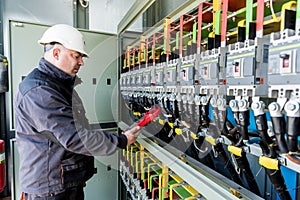 Checking the operating voltage levels of the solar panel switchgear compartment