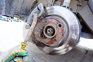Checking and preparing the brake disc of the car. Technical inspection and replacement of parts on the undercarriage of the