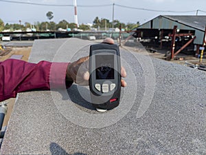 Checking surface profile of steel top flange after steel grit blasting with digital surface profile gauge