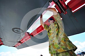 Checking wing of F-111 at Singapore Airshow