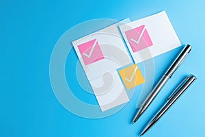 Checklist with checkmarks and notes on blue background