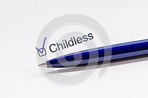 Checklist concept. Childless - checkbox with a tick on white paper with pen photo