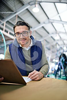 Checklist, package and portrait of man with clipboard for inventory management, logistics or inspection in warehouse