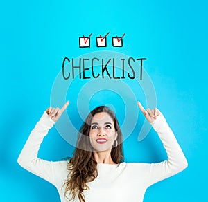 Checklist with young woman looking upwards