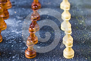 Checkmate and chess Pawn figures close-up