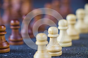 Checkmate and chess Pawn figures close-up