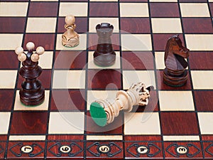 Checkmate,white lost on a wooden Chess Board