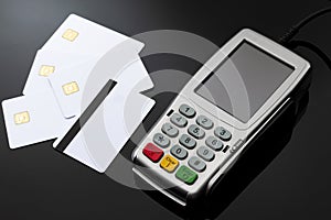Checkout cashier, financial transaction and electronic payments concept with credit and debit card reader with rubber keyboard