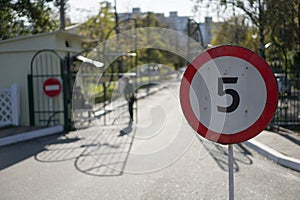 Checkpoint, speed limit sign