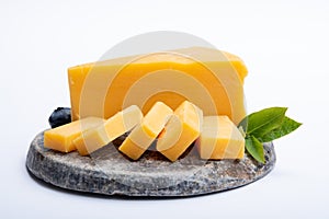 Cheddar cheese collection, piece of yellow Cheddar cheese made from cow milk