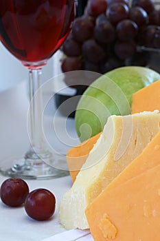 Cheddar cheese with wine and fruit