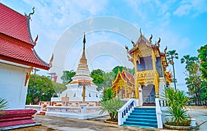 The Chedi and Ho Trai library of Wat Sangkharam Temple, Lamphun, Thailand