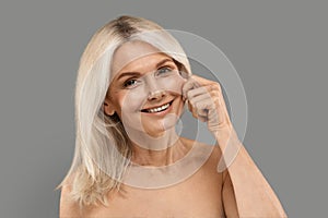 Cheekbone Augmentation. Beautiful Mature Woman Touching Cheek And Smiling At Camera