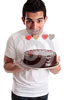 Cheeky man with a birthday cake