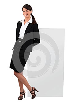 Cheeky woman in a skirt suit