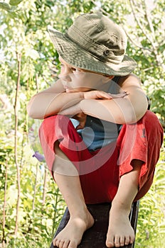 Cheeky young barefoot country boy