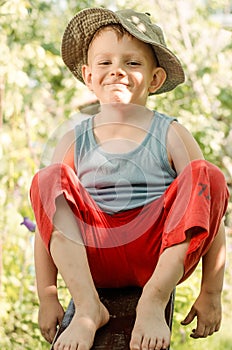 Cheeky young barefoot country boy