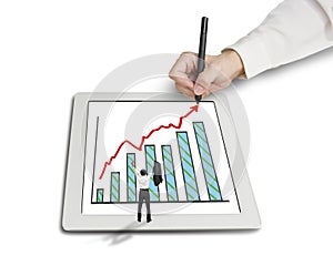 Cheered businessman with growth trend arrow and chart on tablet