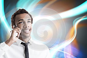 Cheerful African American businessman on phone