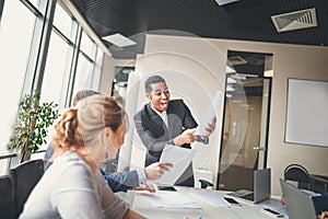 Cheerful african american executive business man at the workspace office