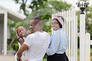 Cheerful african american family in front of their new house, Happiness family concepts