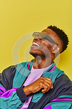 cheerful african american guy in trendy