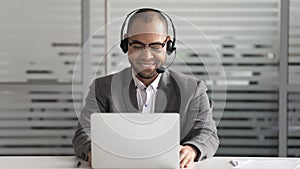 Cheerful african american support service male worker consulting corporate customer.