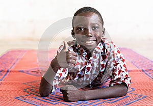 Cheerful African Black Boy Thumbs Up Symbol with Hands