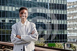 cheerful african business woman looking at camera on financial district