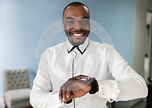 Cheerful African Businessman Enjoying the Benefits of Technology