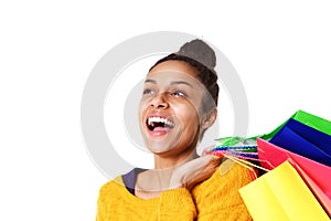 Cheerful african girl with shopping bags