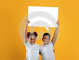 Cheerful afro-american brother and sister with communicative bubble together