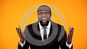 Cheerful afro-american man in businesswear happy with lucrative proposition sale