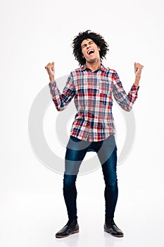 Cheerful afro american man celebrating his success