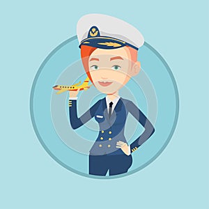 Cheerful airline pilot with model airplane.