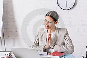 cheerful arabian businesswoman working in office