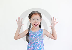 Cheerful asian little child girl peekaboo expression. Kid posture open hands isolated on white background