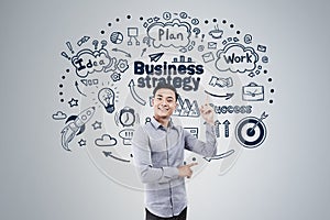 Cheerful Asian man and business strategy