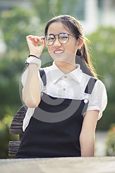 Cheerful asian teenager wearing eyes glasses laughing happiness