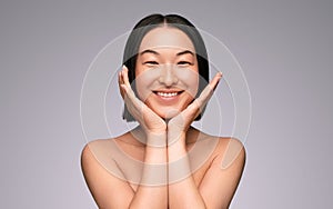Cheerful Asian woman with beautiful skin