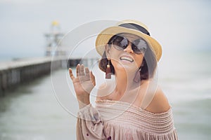 Cheerful  asian woman  happiness emotion at sea beach