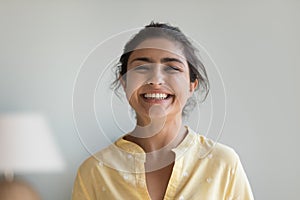 Cheerful attractive Indian woman, head shot portrait