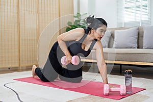 Cheerful attractive young overweight woman in activewear choosing healthy lifestyle