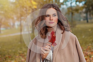 Cheerful autumn woman with long healthy hair