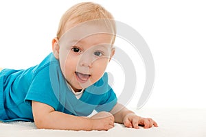 Cheerful baby boy on the blanket